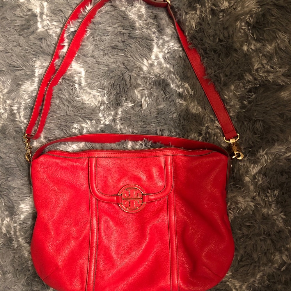 A red Tory Burch bag